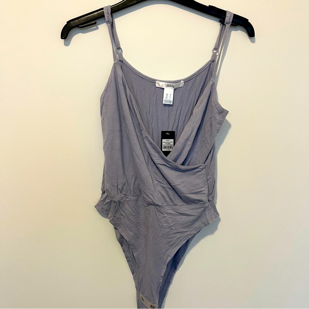 Brand new, purple body suit